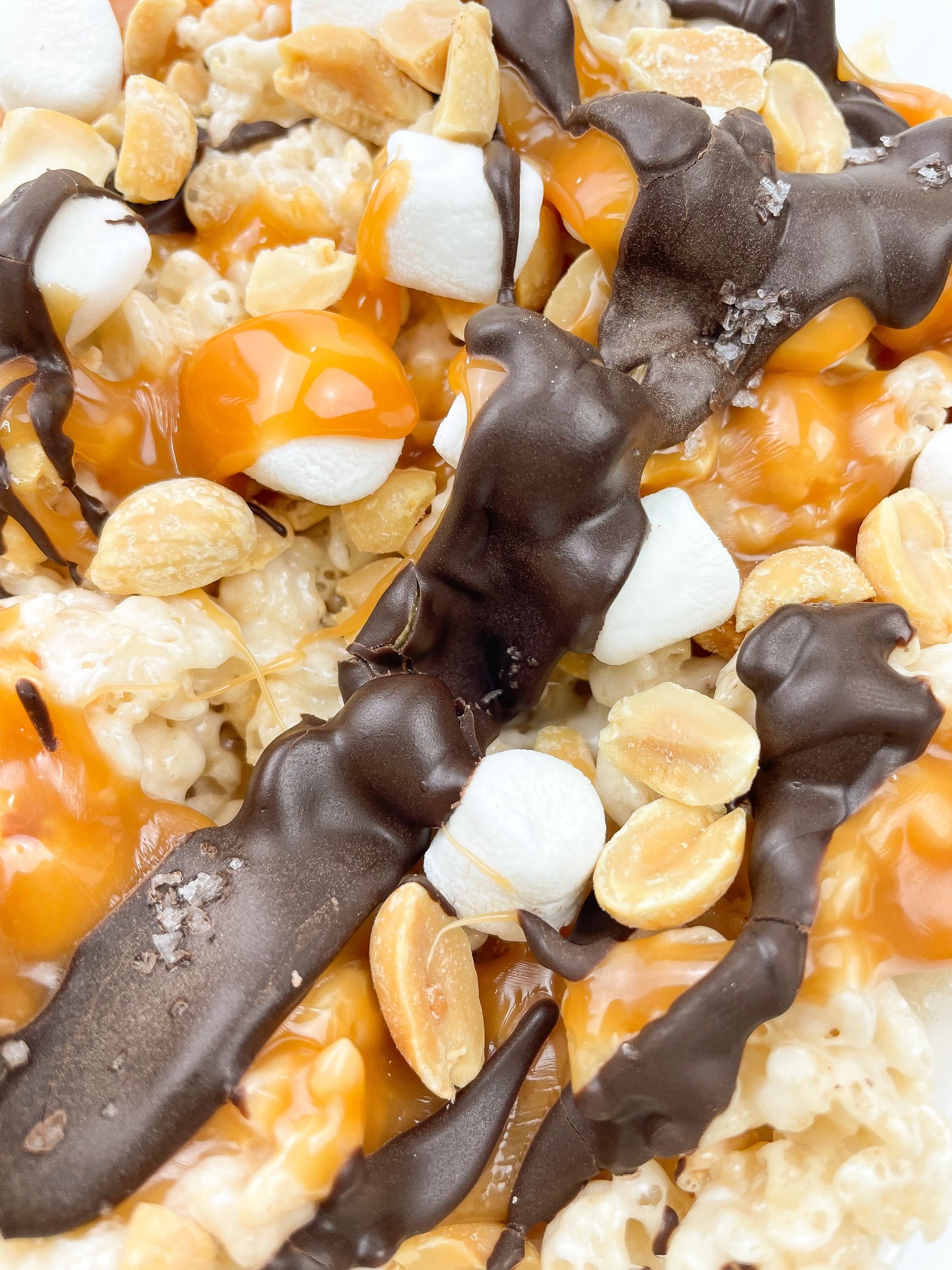Clusters Original w Peanuts Dark Chocolate, Caramel, Peanuts, & Sea Salt Crispie Mix Clusters